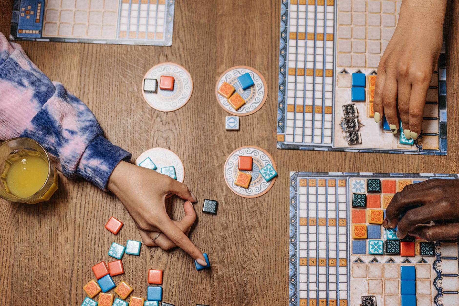Close up on classic wooden game tiles and hands